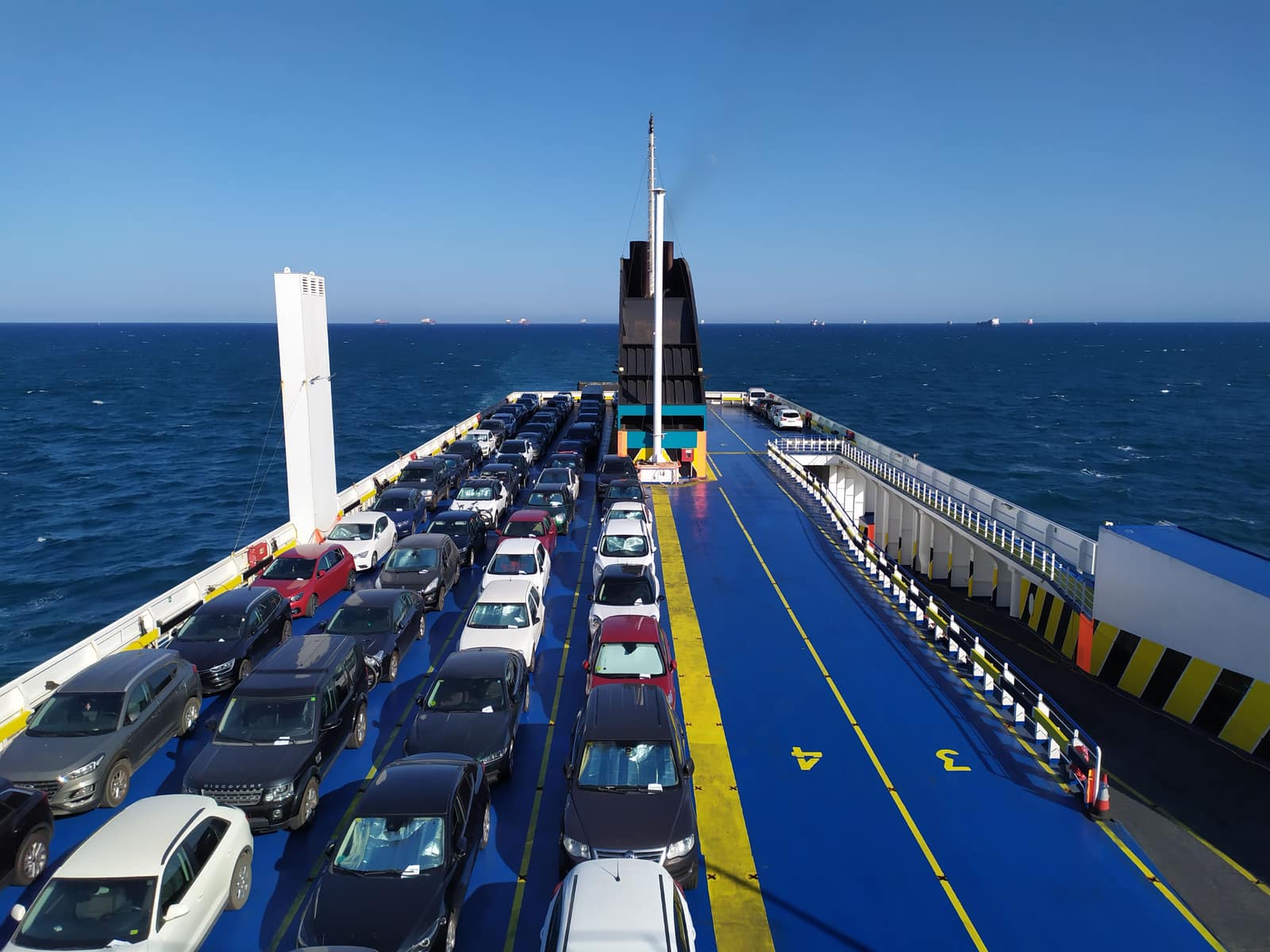 Car being loaded into a shipping container at a Japanese port